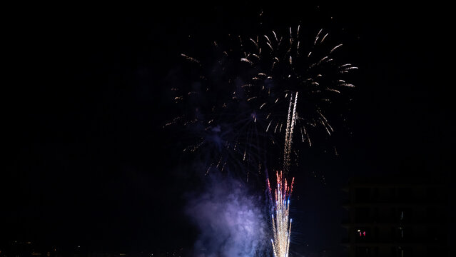vibrant fireworks illuminating a dark night sky