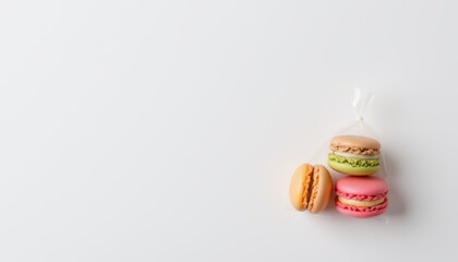 create an art image featuring a plastic bag mockup in the upper left corner against a white background, the bag should be transparent and reveal colorful mini macarons inside