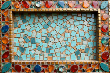 Artistic Mosaic Design Featuring Blue Tiles and Colorful Frame

