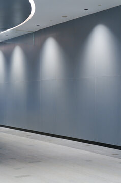 Gray curved corridor inside the building