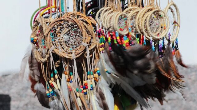 collection of dream catchers hanging henna on the street