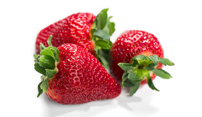 Strawberry isolated on white background. Three Fresh ripe organic strawberries, macro shot of fresh juicy berries, close up. 