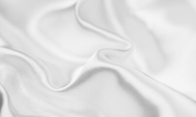 White silk background, texture of beautiful white satin fabric close-up. Abstract smooth backdrop. Top view, flat lay 
