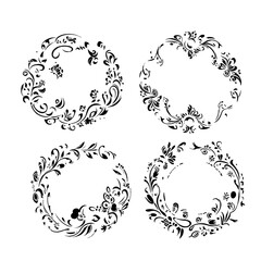 A black and white outline of a blooming flower with detailed petals and leaves. 