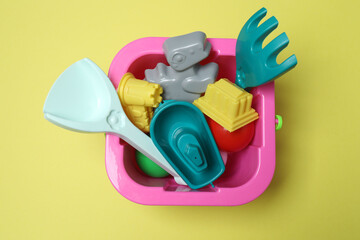 Children's toys on a yellow background