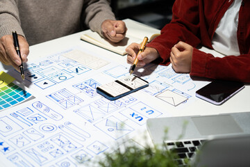 Creative digital development agency. developer team brainstorming on their project with laptop,...