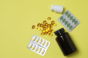 Tablets scattered on a yellow background