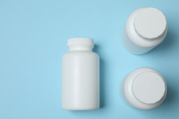 jars of pills on a blue background