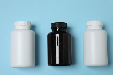 jars of pills on a blue background