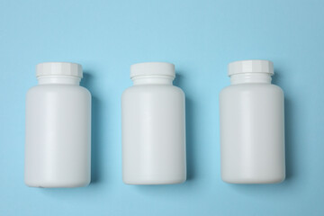 jars of pills on a blue background