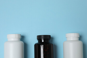 jars of pills on a blue background