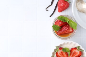 Tasty panna cotta with caramel, strawberries, mint and vanilla pods on white table, flat lay. Space for text