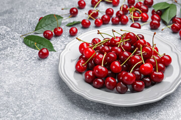Fresh ripe cherries on light table, closeup