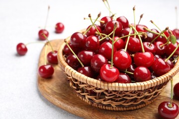 Fresh ripe cherries on light table, closeup