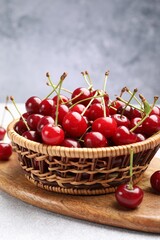 Fresh ripe cherries on light table, closeup