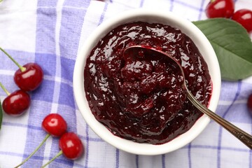 Tasty cherry jam and fresh fruits on table, flat lay