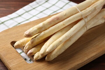 Bunch of asparagus spears on table, closeup
