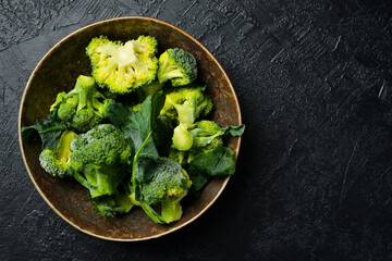 Close-up of a bowl of frozen broccoli. Preparing frozen vegetables for the winter.