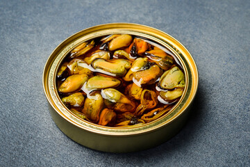 Canned mussels in a metal jar. Canned food in aluminum cans.