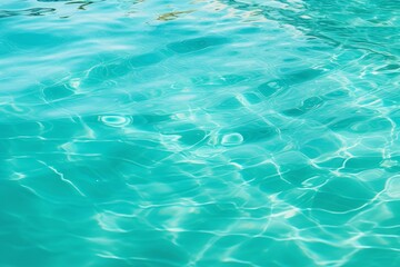 Tranquil turquoise water surface glistening under sunlight, creating a mesmerizing play of light and reflections
