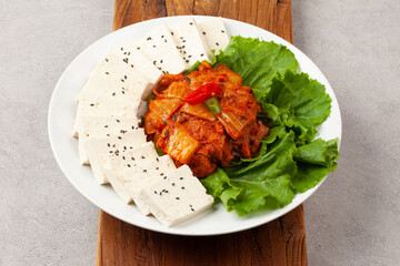 Tofu kimchi is a dish made by boiling tofu and eating it with stir-fried kimchi.