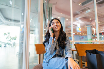 Portrait of smiling happy beauty asian business woman relaxing using digital technology...