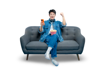 PNG,An excited young man with popcorn holds a smartphone and cheers, celebrating a win in a mobile game or seeing great news.
