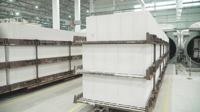 A trolley with a stack of dried aerated concrete blocks