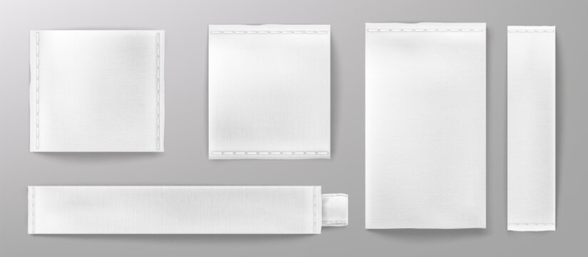 White woven fabric labels mockup collection - blank textile tags with stitched edges, rectangular cloth patches and canvas strips for branding. Empty cotton name badges isolated on gray background.