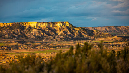 late deep light on cliffs
