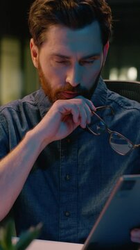 Caucasian middle-aged businessman stock market trader business man broker computer trading analyst CEO manager in night evening office professional employer in glasses tired overtime working overwork