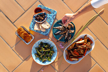 Mediterranean Tapas Flatlay with Grilled Sardines and Sides