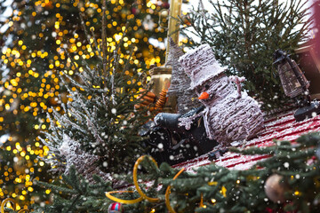 Holiday snowmen on the streets of Moscow. Christmas background with a snowman. Concept of...