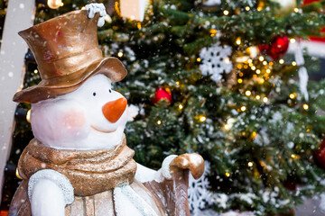 Holiday snowmen on the streets of Moscow. Christmas background with a snowman. Concept of...
