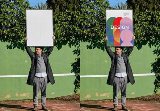 Mockup Of Man With Vertical Customized Framed Print Above Head
