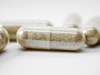 Herbal medicine capsule isolated on white background, Close-up of Herbal medicine capsule