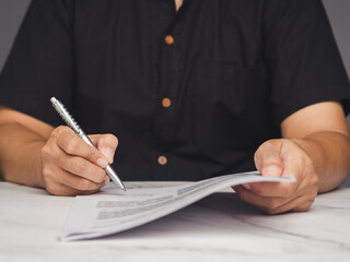Businessman holding cash and calculating budget, financial planning or investment decision scene.