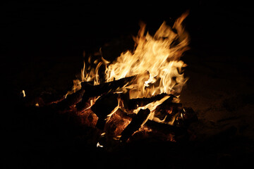 bonfire burning on the beach at night during the san juan bonfires festival in spain