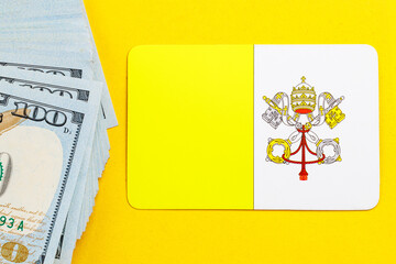 Vatican flag with us dollars on yellow background reflecting financial concept