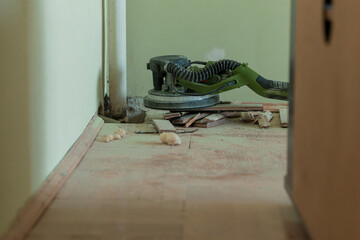 Interior Renovation with Power Floor Sander, Wood Dust, Parquet Flooring, Light Brown Color Scheme,...
