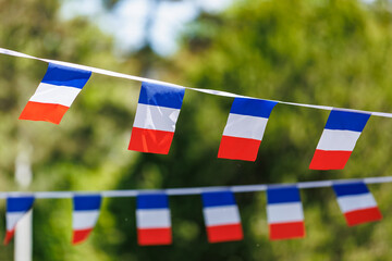 Colorful french flags bunting on a sunny day