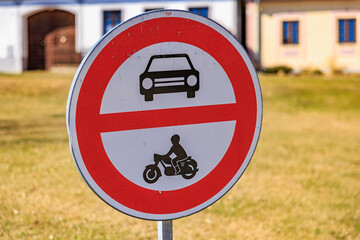 Prohibition sign indicating no entry for cars and motorcycles outdoors