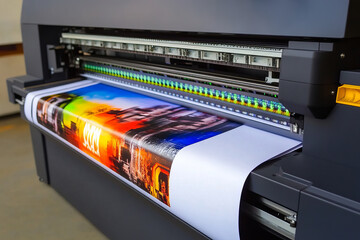 Large format color printer printing vibrant poster for commercial advertising and marketing