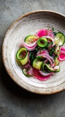 Wakame salad with red onion and cucumber in a vinegar dressing.
