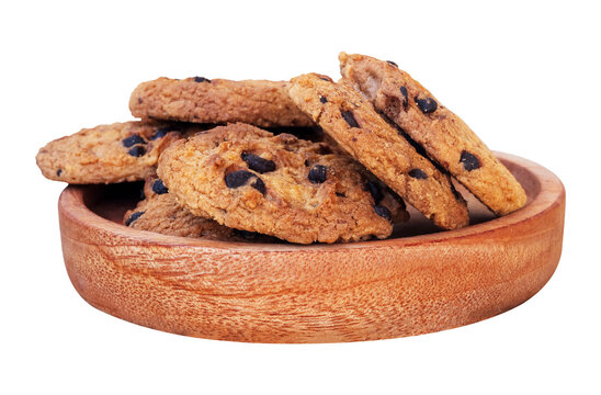 delicious chocolate chip cookies in a wooden plate isolated on white background