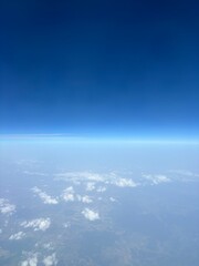 blue sky with clouds, view from an airplane window