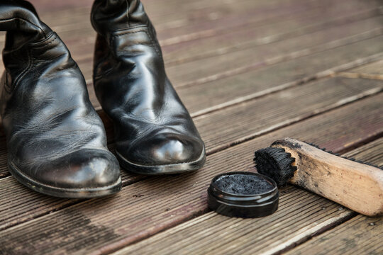 One polished and one unpolished boot