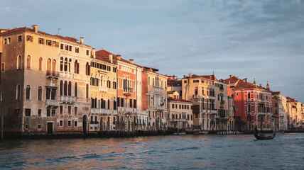 Stunning sunset illuminates Venetian architecture along the canal