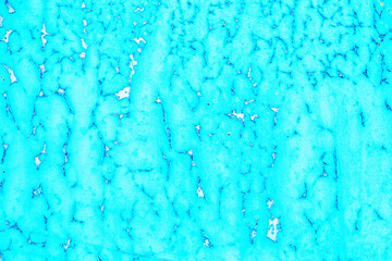 Old blue paint peeling from metal or concrete wall texture backg