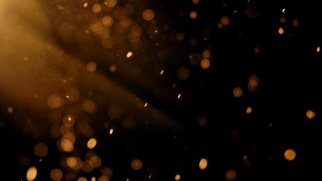 Warm golden dust particles in light beam